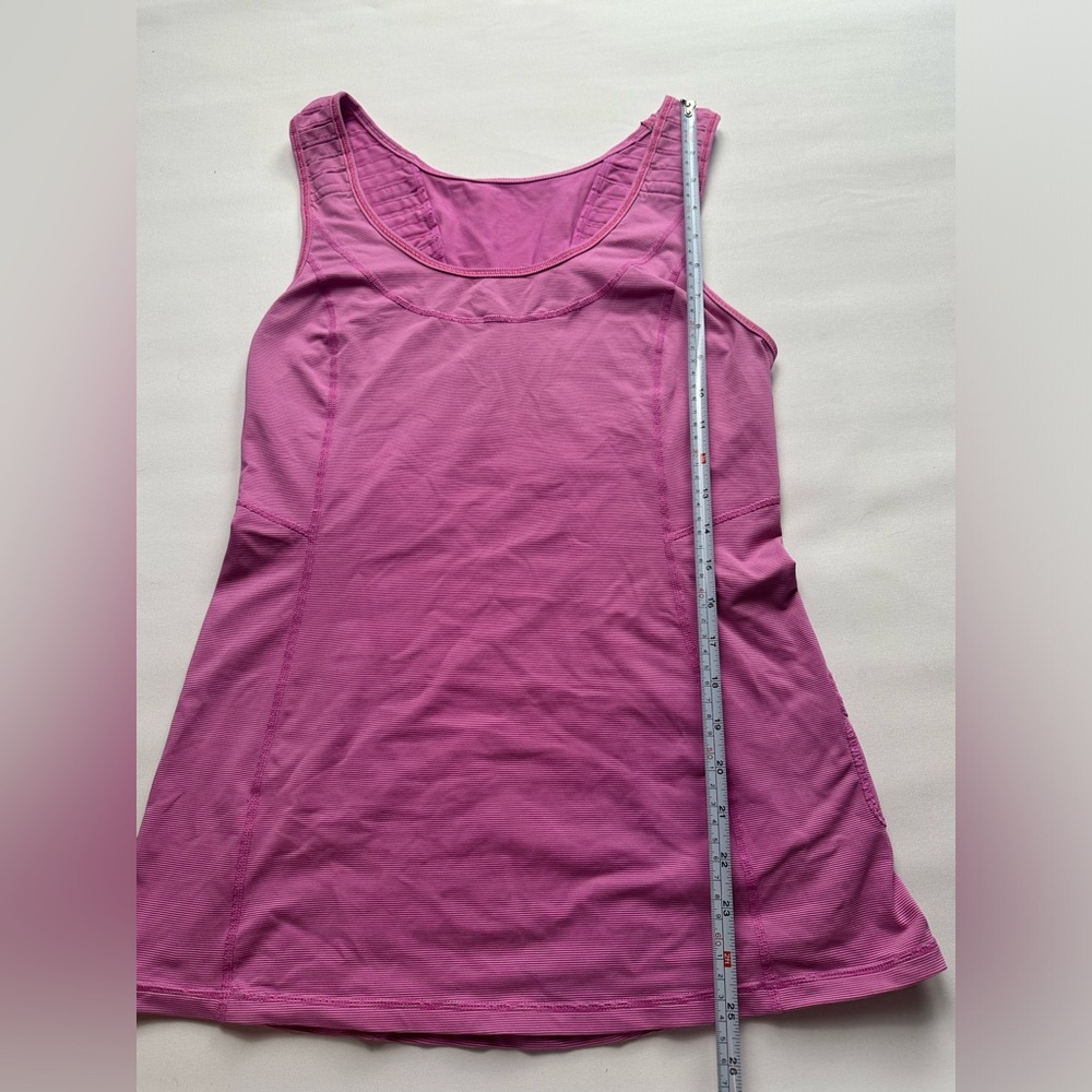 Lululemon pink thinly striped tank top with pleated detail on back. Size 8